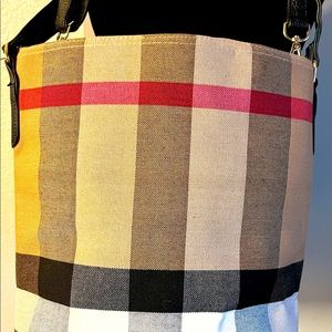 Tan black and red plaid purse.